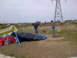 Government Affairs director, Thomas Bryll, celebrates the disposal of a discarded trampoline.